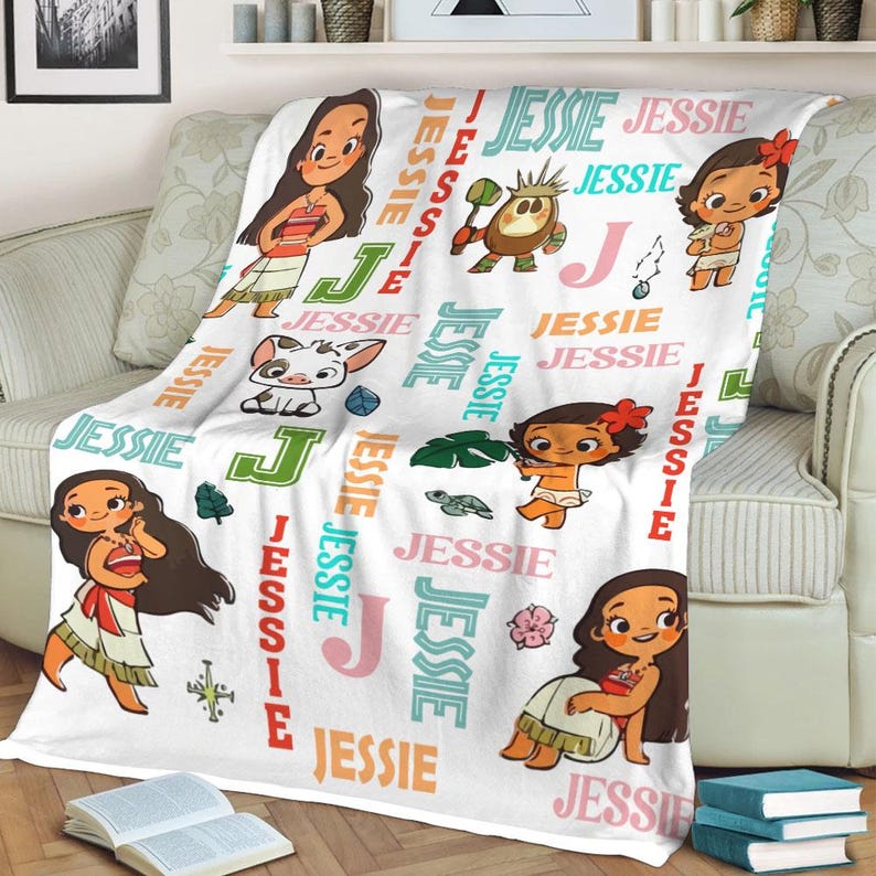 May include: A white blanket with cartoon characters and the name "Jessie" in different colours and fonts. The blanket features illustrations of a girl with long brown hair, a pig, and other tropical-themed images. The word "Jessie" is repeated throughout.