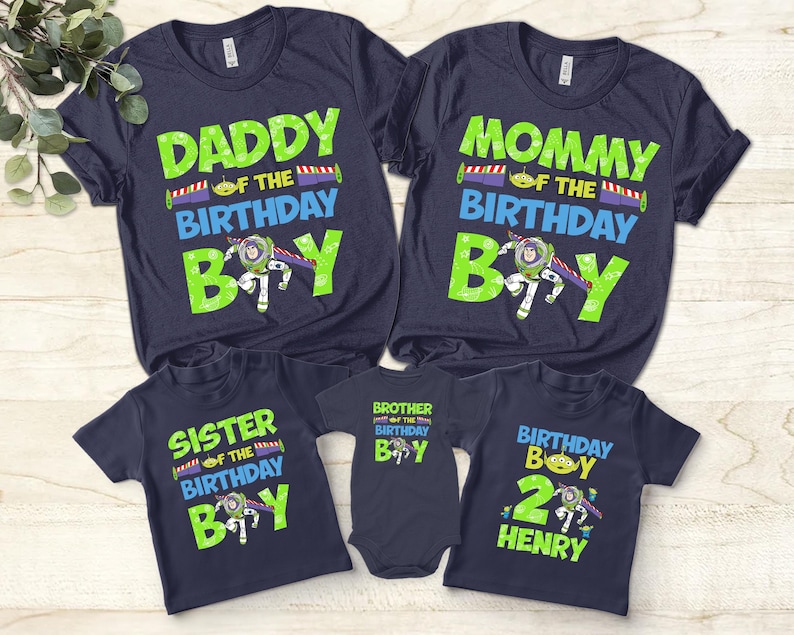 May include: Navy blue t-shirts with green and blue text. The shirts read "Daddy of the Birthday Boy", "Mommy of the Birthday Boy", "Sister of the Birthday Boy", "Brother of the Birthday Boy", and "Birthday Boy 2 Henry".