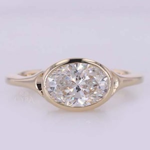2 Carat Oval Lab Grown Diamond Ring: Bezel Set Split Shank Cathedral Engagement