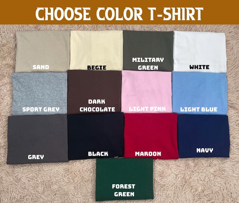 May include: A selection of folded t-shirts in various colors, including sand, beige, military green, and white. The image displays the text "CHOOSE COLOR T-SHIRT" at the top, with each shirt labeled with its color name.