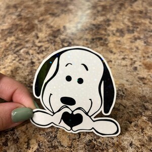 Snoopy Heart Hands Holographic Sticker • Peanuts Vinyl Decal • Cute Love Gift • Waterproof Sticker for Laptop, Journal, or Tumbler