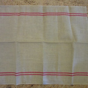 May include: A plain white tea towel with two red stripes along the top and bottom edges.