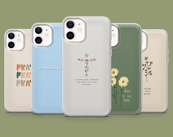 May include: A collection of five phone cases in various colors. The cases feature inspirational quotes and floral designs. One case has the word "PRAY" in a stacked design. Another says "Jesus said c". The third case has a cross design with the text "LOVING GOD CHANGES THE WAY YOU LOVE OTHERS."