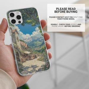 May include: Clear phone case featuring a scenic landscape painting of a European village with a church, mountains, and blue sky. The case has the text "PLEASE READ BEFORE BUYING".