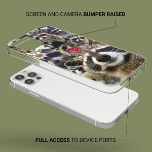 May include: A clear phone case with a colorful design of raccoons. The case has a raised bumper around the edges to protect the phone's screen and camera. The text "SCREEN AND CAMERA BUMPER RAISED" is printed at the top of the case. The text "FULL ACCESS TO DEVICE PORTS" is printed at the bottom of the case.