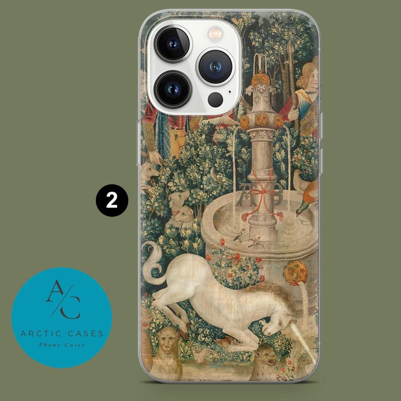 May include: Clear phone case featuring a detailed tapestry design with a white unicorn, fountain, and figures. The case has a transparent border and the number "2" is visible. The Arctic Cases logo is in the lower left corner.