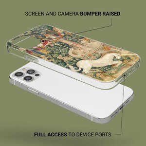 May include: A clear phone case with a detailed tapestry design featuring a white unicorn. The case is layered over a white phone, showcasing the screen and camera bumper. The case provides full access to device ports.