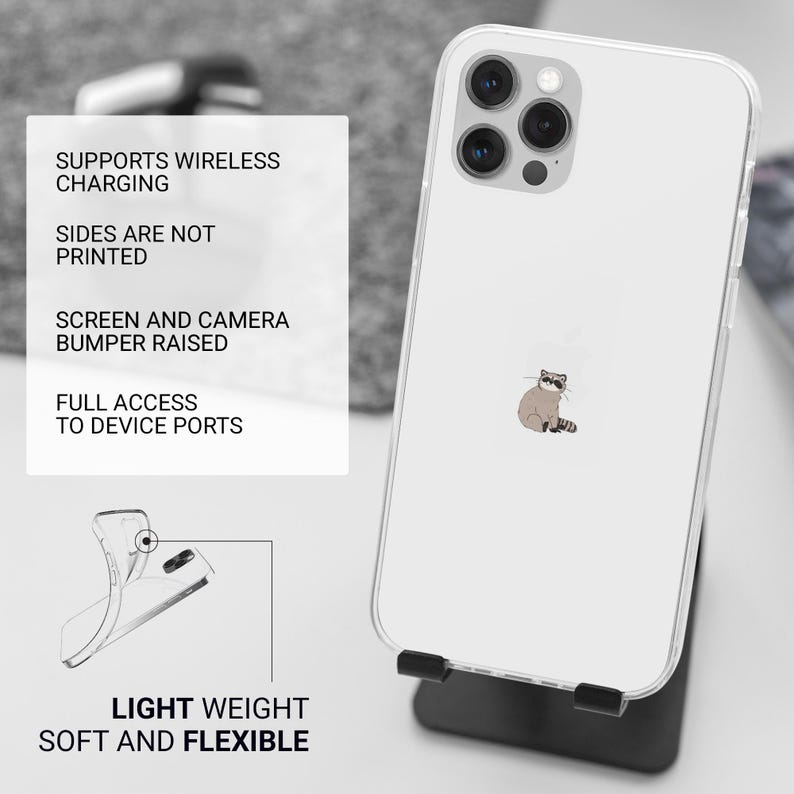May include: A clear phone case with a cartoon raccoon design. The case is compatible with wireless charging and has raised edges to protect the screen and camera. The case is lightweight and flexible.