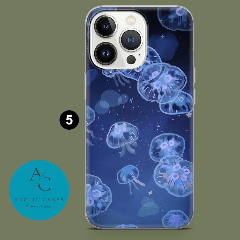 May include: A clear phone case with a blue and white design featuring jellyfish. The case has a raised camera bump and a clear back.