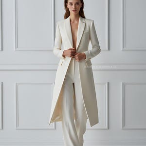 Elegant bridal pantsuit outfit in ivory white with long coat and trousers
