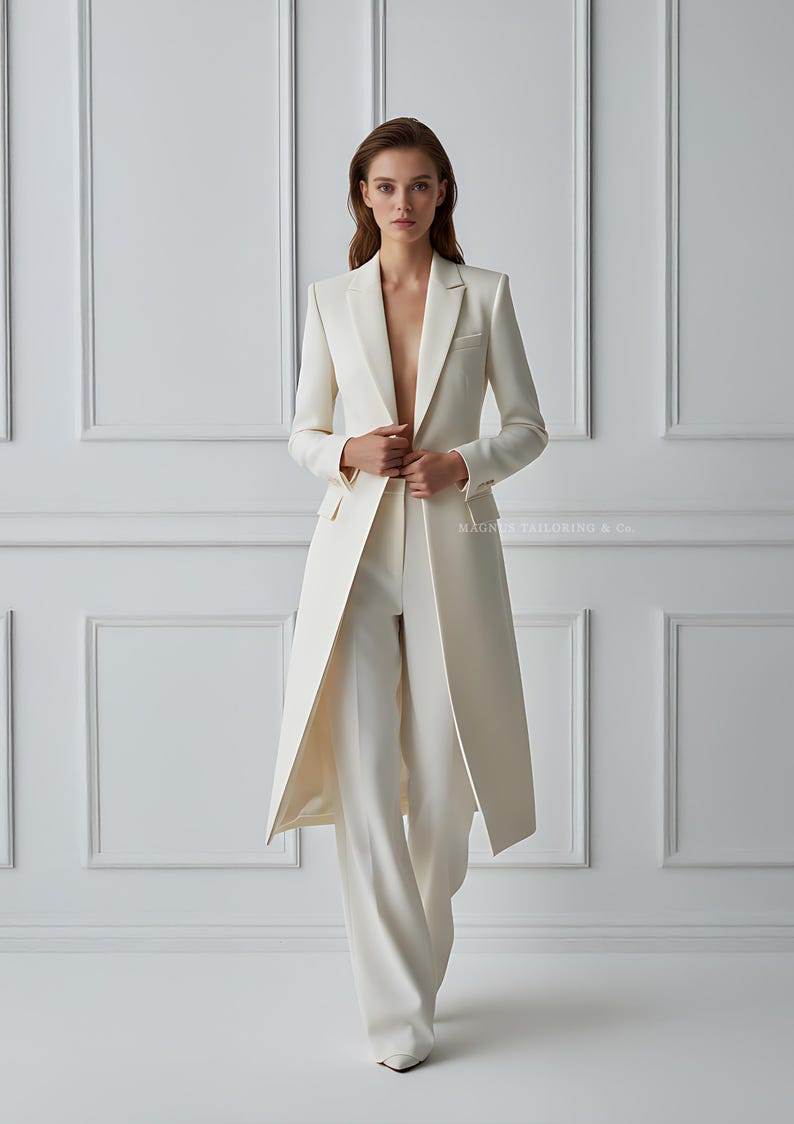 Elegant bridal pantsuit outfit in ivory white with long coat and trousers