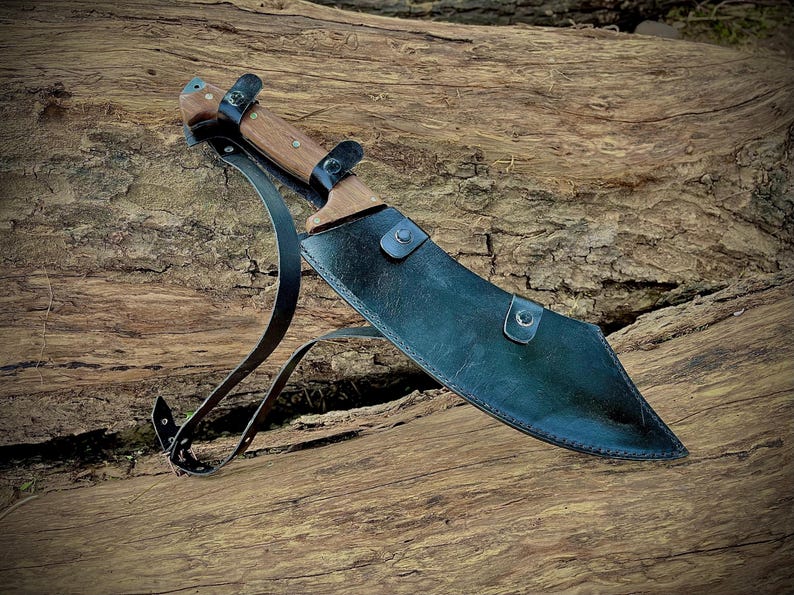 High-performance hand-forged machete blade made from 1095 carbon steel. This large knife is built for durability, precision, and strength, making it a great survival knife or camping companion. Ideal gift for outdoorsmen, hunters, and those who appreciate handmade quality knives.