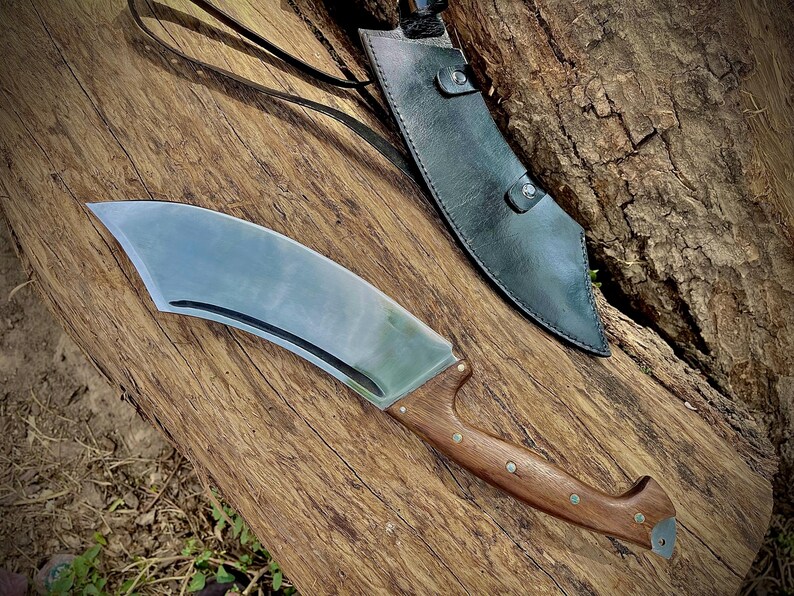 Beautiful handmade machete knife crafted with high-carbon steel and finished with a durable handle. Ideal as a gift for your father or husband on special occasions like birthdays or Father’s Day. Strong, sharp, and practical for camping, chopping, or bushcraft use. A lasting tool and memorable gift.