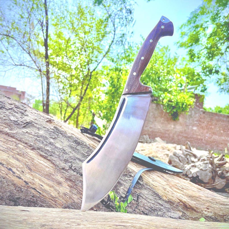 Handmade machete knife crafted from high-carbon 1095 steel with a full tang design. This rugged, large outdoor knife is ideal for camping, chopping, and survival use. A thoughtful gift for him, your father, or any outdoor lover on birthdays or special occasions. Built for performance and durability with a custom handcrafted touch.