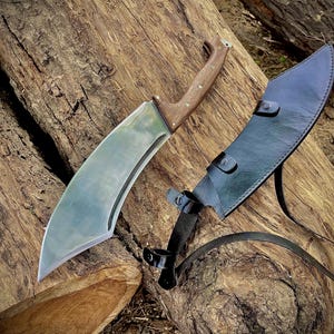 Large handmade camping knife ideal for gifting on birthdays, especially for men who love outdoor gear. Features a forged 1095 steel blade and full tang construction. Comes with a custom-fit leather sheath for safe and stylish carrying. Great for hikers, hunters, and wilderness lovers.