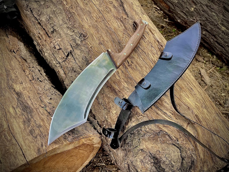 Large handmade camping knife ideal for gifting on birthdays, especially for men who love outdoor gear. Features a forged 1095 steel blade and full tang construction. Comes with a custom-fit leather sheath for safe and stylish carrying. Great for hikers, hunters, and wilderness lovers.