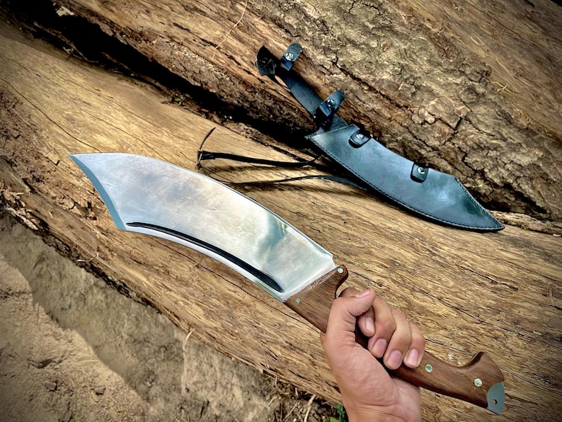 A rugged outdoor machete knife made with high-carbon steel and designed for adventure. Perfect as a birthday gift for dad or an outdoor enthusiast, this handmade blade combines traditional style with reliable performance. Durable, beautiful, and functional for heavy use in the field.