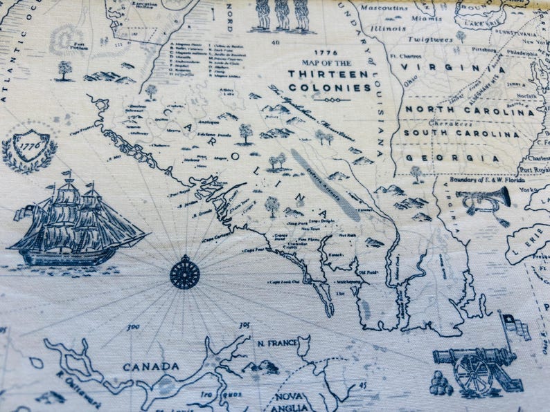 May include: A detailed map of the Thirteen Colonies from 1776, rendered in blue ink on a cream-colored background. The map includes illustrations of a sailing ship, a compass rose, and a cannon. The text "1776 MAP OF THE THIRTEEN COLONIES" is prominently displayed.