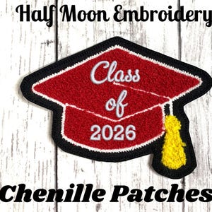 May include: A red chenille graduation cap patch with a black border and a yellow tassel. The patch features white embroidered text that reads Class of 2026. The design is shaped like a mortarboard hat with a textured surface and a black outline.