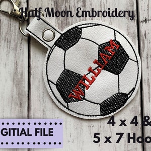 May include: White soccer ball keychain with black stitching and a red embroidered name "WILLIAM". The keychain is designed for 4x4 and 5x7 hoop embroidery machines.