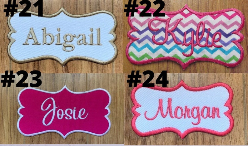 May include: Four embroidered iron-on patches with different names. The patches are in a variety of colors and patterns, including pink, white, blue, and green. The names on the patches are Abigail, Kylie, Josie, and Morgan.