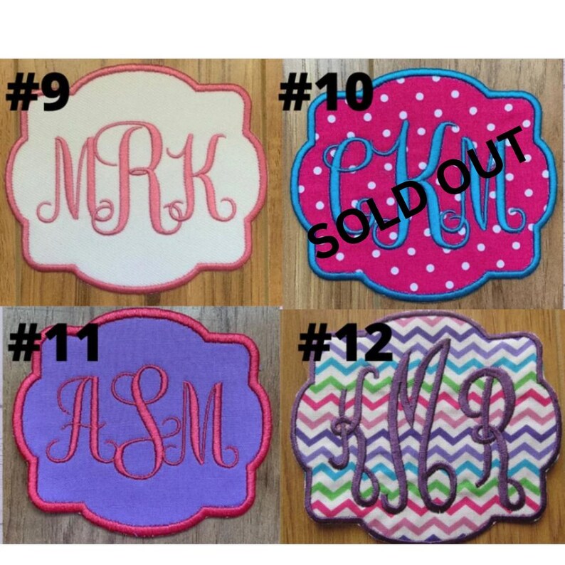 May include: Four embroidered patches with different monogram designs. The patches are in various colors, including white, pink, purple, and a chevron pattern. One patch has the text "SOLD OUT". Each patch has a unique monogram letter combination.