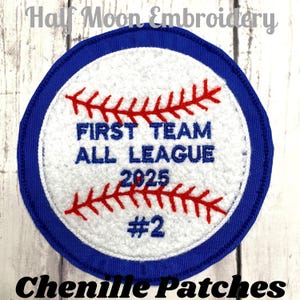 May include: A round baseball patch with a white center and a blue border. The patch features red stitching, the text "FIRST TEAM ALL LEAGUE 2025 #2" in blue, and the text "Half Moon Embroidery" and "Chenille Patches" in the image.