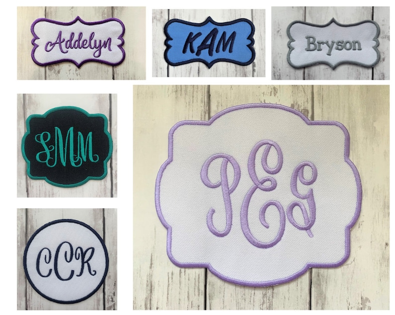 May include: A collection of embroidered patches with various names and initials. The patches are in different colors and styles, including a white patch with purple lettering, a black patch with teal lettering, a blue patch with white lettering, a gray patch with white lettering, and a white patch with light purple lettering.