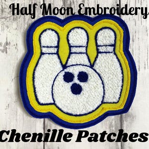 May include: Chenille patch featuring a bowling ball and three pins. The patch has a white, textured design with blue and yellow borders. Text at the top reads "Half Moon Embroidery" and at the bottom "Chenille Patches".