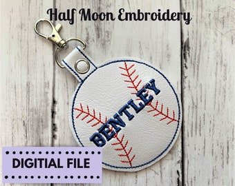 May include: White leather baseball-shaped keychain with red and blue embroidery. The word "BENTLEY" is stitched in blue on the baseball. The keychain has a silver metal clasp.