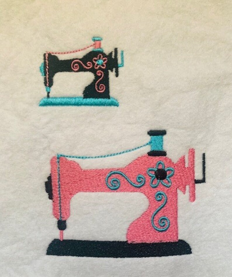 May include: Two embroidered sewing machines, one black with turquoise thread and the other pink with turquoise thread.