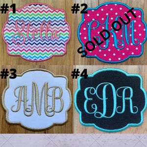 May include: Four embroidered patches with decorative borders. Patch #1 has a chevron pattern and the name "Stella". Patch #2 is pink with white polka dots and the letters "CM". Patch #3 is white with gold letters "AMB". Patch #4 is black with teal letters "EDR".