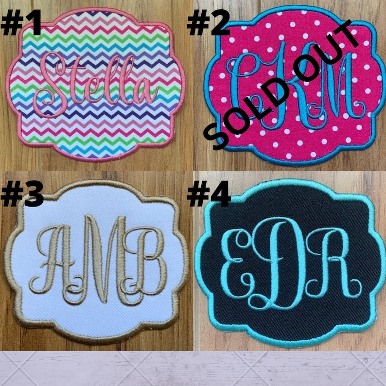 May include: Four embroidered patches with decorative borders. Patch #1 has a chevron pattern and the name "Stella". Patch #2 is pink with white polka dots and the letters "CM". Patch #3 is white with gold letters "AMB". Patch #4 is black with teal letters "EDR".