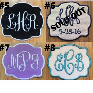 May include: Four embroidered patches with different monogram designs. The patches have a scalloped edge and feature the initials LHR, MPJ, and EB3 in white or teal thread. One patch is labeled "SOLD OUT".