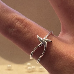 KüstenDrifter Ring 925 Sterling Silber Seestern glänzend silbrig Unikat zierlich Ozean inspiriert Meer Unterwassertier Stern Schmuckstück Kollektiv
