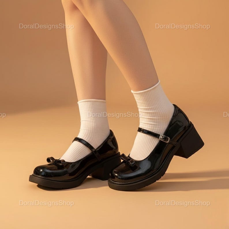 May include: Black patent leather Mary Jane style shoes with a bow detail and a chunky heel. The shoes have a strap across the top with a buckle closure. The heel height is approximately 2.5 inches.