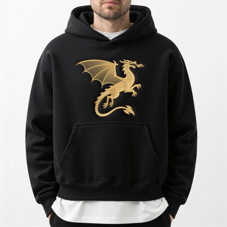 May include: Black hooded sweatshirt with a gold dragon graphic on the front. The dragon is depicted with outstretched wings and flames. The sweatshirt has a kangaroo pocket and a drawstring hood.