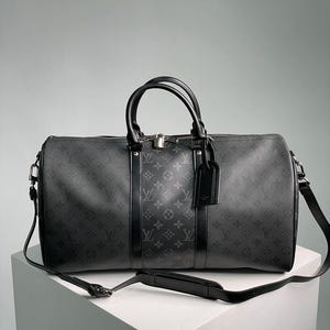 Louis Vuitton Keepall Bandoulière zwarte reistas met monogram