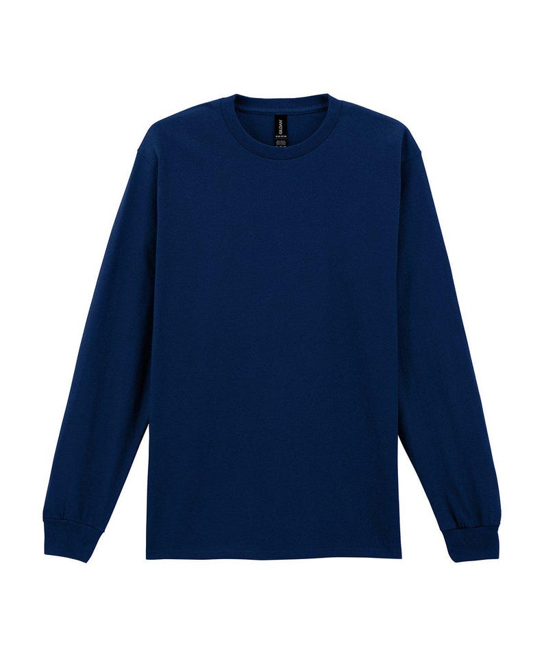May include: A long-sleeved, navy blue crew neck shirt. The shirt has a classic design with a ribbed cuff at the wrist. The fabric appears to be a soft, comfortable material. The shirt is displayed on a white background.