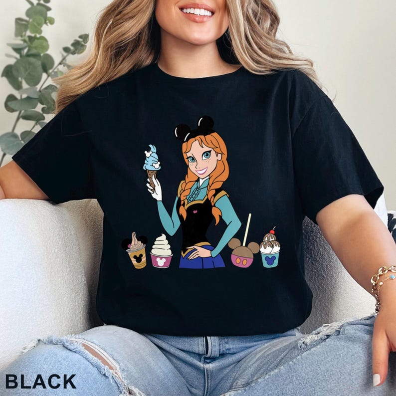 May include: A white ceramic mug with a black handle and the text "But First, Coffee" in a black, handwritten-style font. The mug is on a white surface.