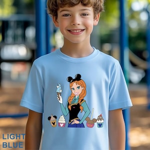May include: Light blue t-shirt featuring a cartoon image of a character holding ice cream cones. The character has red hair and is wearing black mouse ears. The text "LIGHT BLUE" is at the bottom left of the shirt.