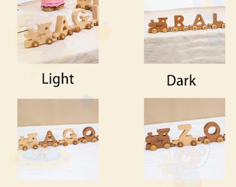 May include: Wooden toy train sets with individual letter cars spelling out names. The trains are in light and dark wood tones, with some sets mixed. The names "Agnes", "Ralph", and "Izzy" are visible on the train cars.