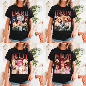 May include: Four black t-shirts with different graphics. Each shirt features a vintage-style image of a group of people and a name in red lettering: HARU, HYUN, RUI, and WUMUTI. The shirts are short-sleeved.