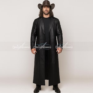 May include: A long, black leather coat with a traditional lapel. The coat is paired with a black top, black trousers, and black boots. A brown cowboy hat is also worn.