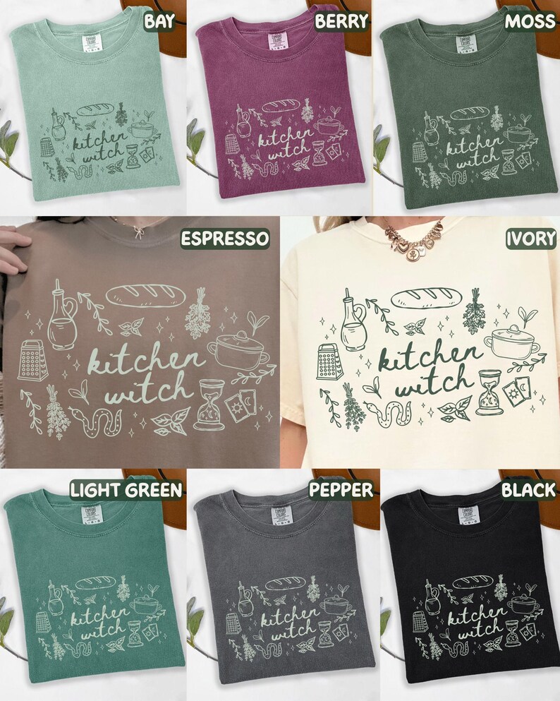 Kitchen Witch Comfort Colors shirt shown in Bay, Berry, Moss, Espresso, Ivory, Light Green, Pepper, and Black color options featuring hand-drawn cottagecore kitchen and witchy illustrations surrounding the phrase "kitchen witch."
