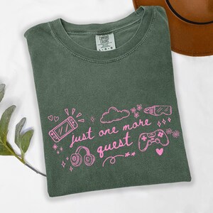 Moss green Comfort Colors shirt with pink gamer girl design just one more quest aesthetic tee
