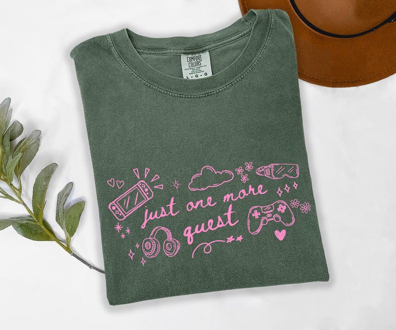 Moss green Comfort Colors shirt with pink gamer girl design just one more quest aesthetic tee