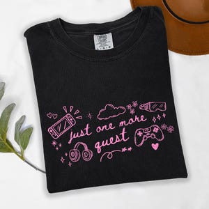 Black Comfort Colors gamer shirt with pink just one more quest design and cozy gaming doodle illustration