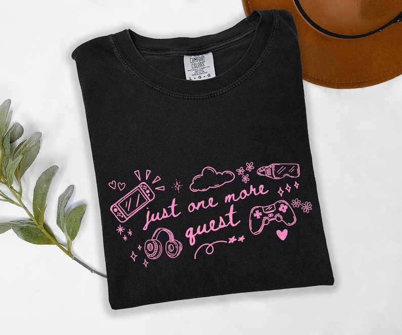 Black Comfort Colors gamer shirt with pink just one more quest design and cozy gaming doodle illustration