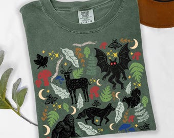 Forest Friends Cryptid Shirt: Linocut Woodland Mothman Bigfoot T-Shirt, Cottagecore Forestcore Graphic Tee, Folklore Shirt for Cryptid Lover
